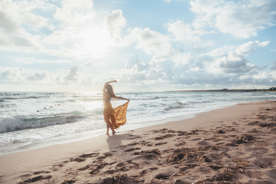 Boho Girl Walking on the Beach